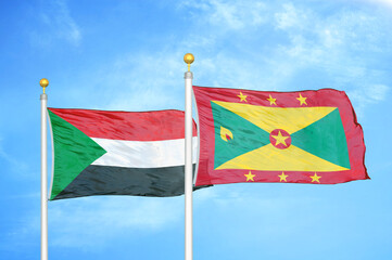 Sudan and Grenada two flags on flagpoles and blue sky