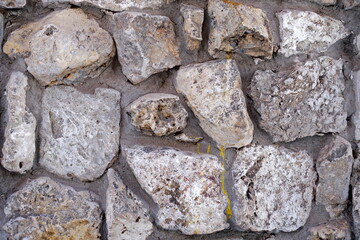 Masonry stone wall. Ancient medieval stone masonry.