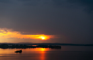 sunset at coast of the lake