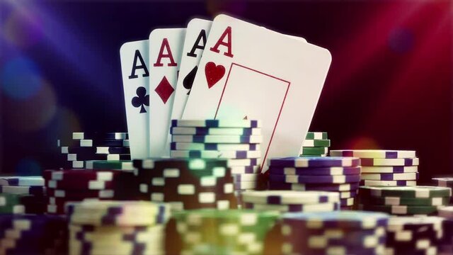 4 Aces Poker and Chips rotating on black background with show lights. Seamlesly loop