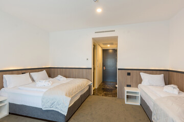 Interior of a hotel bedroom with baby cot
