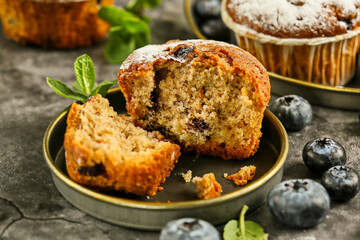 Freshly baked blueberry muffins. Cupcakes sprinkled with powdered Sugar.