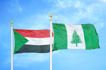 Naklejka na ściany i meble Sudan and Norfolk Island two flags on flagpoles and blue sky