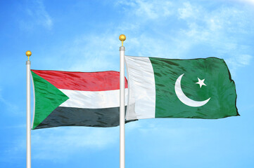 Naklejka na ściany i meble Sudan and Pakistan two flags on flagpoles and blue sky