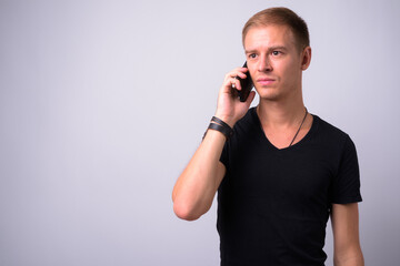 Portrait of handsome man against white background