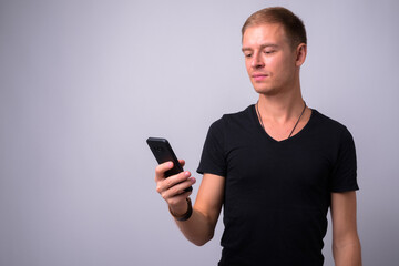 Portrait of handsome man against white background