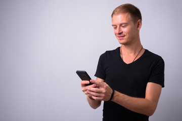 Portrait of handsome man against white background