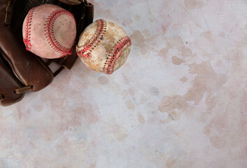 old baseball glove on vintage texture background with copy space.