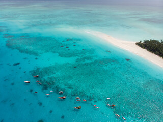 Aerial view of Mnemba Atoll in Zanzibar - The Famous Spot for Snorkeling and Boat Tour