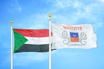 Naklejka na ściany i meble Sudan and Mayotte two flags on flagpoles and blue sky