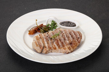 Grilled pork steak with pepper sauce