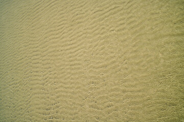 textura de areia da praia onde o mar faz a decoração.
fundo para aplicaticos e outros designer