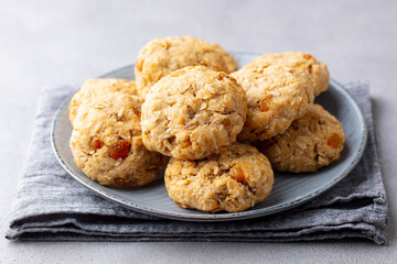 Healthy vegan oat cookies. Grey background. Close up.