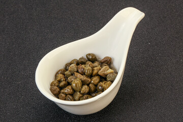 Tasty capers in the bowl