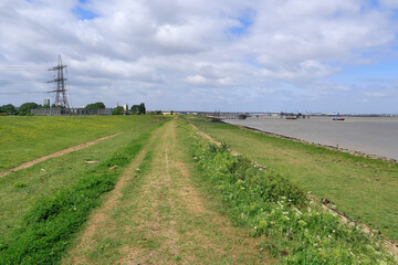 Fototapeta na wymiar The Saxon Shore Way and the busy industrial River Thames at Gravesend