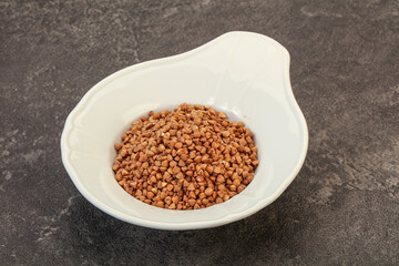 Raw buсkwheat cereal in the bowl