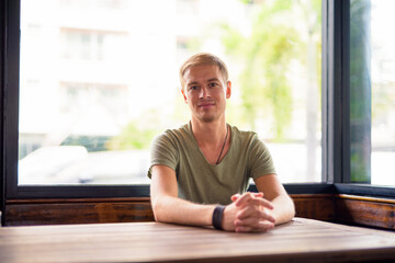Handsome man relaxing in the coffee shop