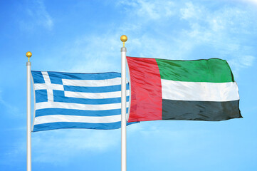 Greece and United Arab Emirates two flags on flagpoles and blue sky