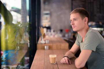 Handsome man relaxing in the coffee shop