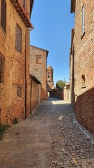 Naklejka premium View between the ancient buildings of Città della Pieve, Italy.