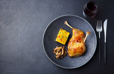 Duck legs confit with mushroom sauce. Copy space. Top view.