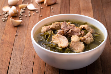 Pickled lettuce soup with pork belly soup