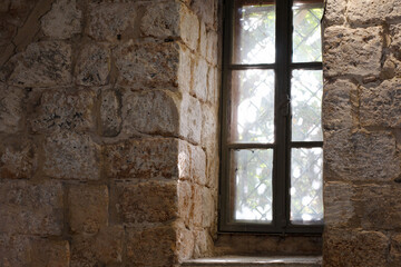 Fototapeta na wymiar Old window in a stone house