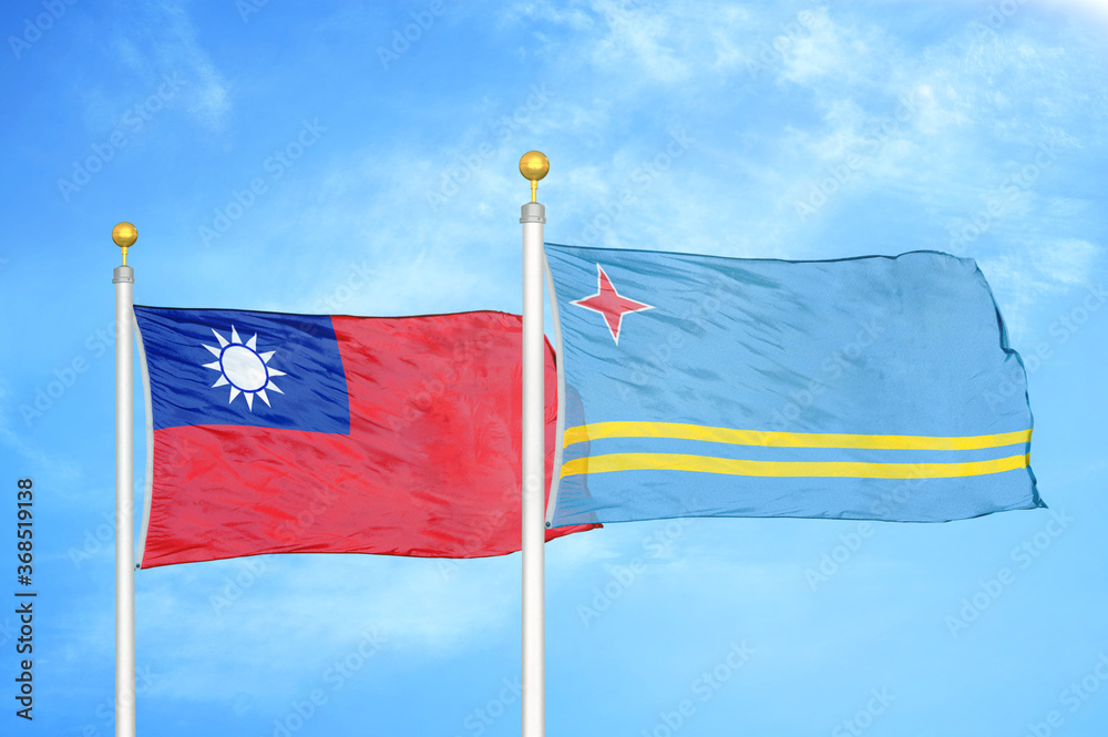 Wall mural taiwan and aruba two flags on flagpoles and blue sky