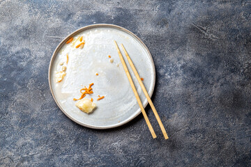 Empty dirty dish after korean kimchi with chopstick