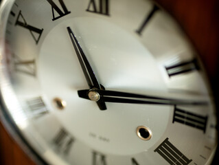 Hands of the dial of a vintage wall clock