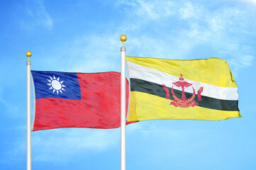 Taiwan and Brunei two flags on flagpoles and blue sky