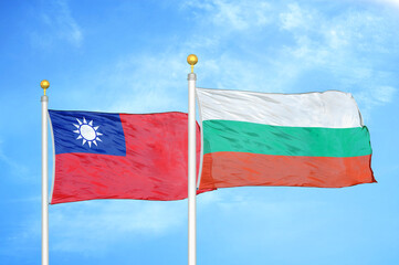 Taiwan and Bulgaria two flags on flagpoles and blue sky