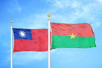 Taiwan and Burkina Faso two flags on flagpoles and blue sky