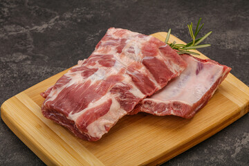 Raw pork ribs served rosemary