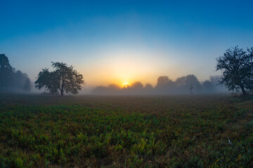 Babenhausen Sonnenuntergang mit Nebel