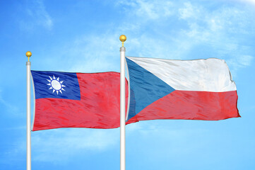 Taiwan and Czech Republic two flags on flagpoles and blue sky