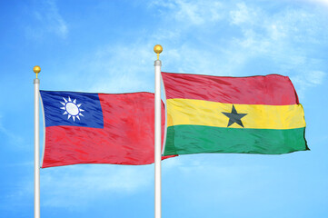 Taiwan and Ghana two flags on flagpoles and blue sky