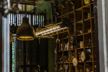 Bangkok, Thailand - Jun 26, 2020 : Vintage Interior design house. Decoration of wooden wall shelves and old lamps. No focus, specifically.