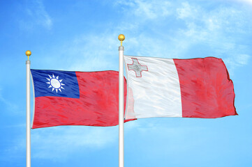 Taiwan and Malta two flags on flagpoles and blue sky