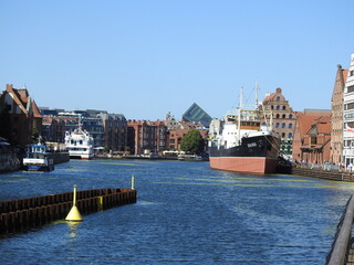 Motława in Gdańsk - the Sołdek ship and numerous tenement houses