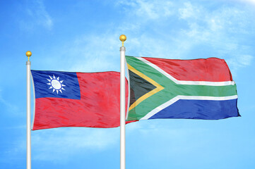 Taiwan and South Africa two flags on flagpoles and blue sky