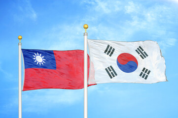 Taiwan and South Korea two flags on flagpoles and blue sky