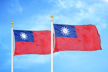 Taiwan two flags on flagpoles and blue sky