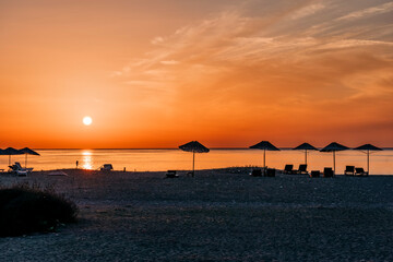 Beach umbrellas at sunrise