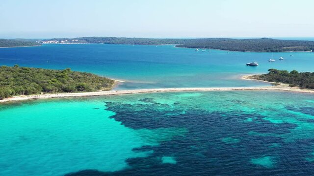 Beautiful exotic islands with natural bridge in turquoise sea on the island of Dugi Otok in Croatia, drone aerial footage