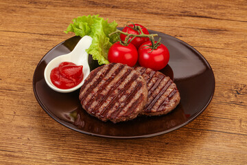 Grilled burger cutlet with sauce