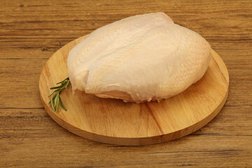 Fototapeta na wymiar Raw whole chicken breast with skin