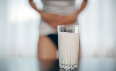 lactose intolerance concept. Woman touching her belly and having a stomach pain.
