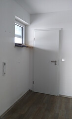 ready for moving in - empty white hall with door and window