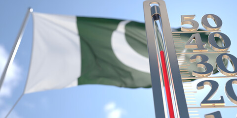 Thermometer shows high air temperature against blurred flag of Pakistan. Hot weather forecast related 3D rendering